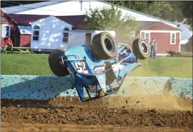  ?? CARL HESS — FOR MEDIANEWS GROUP ?? Action started early as Chase Dietz climbed the third turn wall and flipped his SpeedSTR during timed warmups for the division. Dietz was uninjured but the car was done for the night.