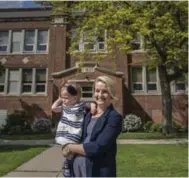  ?? J.P. MOCZULSKI FOR THE TORONTO STAR ?? Hamilton teacher Adrienne Havercroft, with daughter Adeline, is challengin­g the funding of Catholic schools in Ontario.