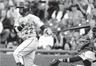  ??  ?? ■ Pittsburgh Pirates’ Andrew McCutchen singles off San Francisco Giants starting pitcher Ryan Vogelsong during a game June 1, 2015, in San Francisco. At right is Giants catcher Buster Posey. McCutchen and Posey are now teammates with the Giants.