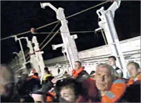  ?? DIEGO NOBILE & EMILIE BLACHERE ?? Photograph­s taken by passengers show the evacuation of the Costa Concordia before the liner began listing too heavily for lifeboats to be launched. The captain is accused of abandoning ship four hours before the last passengers