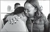  ?? MIKE DE SISTI/MILWAUKEE JOURNAL-SENTINEL ?? Bernice Parks, left, is consoled by Jasmine Wells, the godmother to Sandra Parks, on Tuesday in Milwaukee. Sandra Parks, 13, was killed Monday in her bedroom.