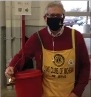  ?? COURTESY ROYAL OAK LIONS CLUB ?? Royal Oak Lions Club member Eric Boreczky rings the bell to collect donations for the Salvation Army at the Sam’s Club in neighborin­g Madison Heights.