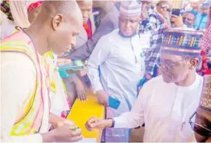  ?? ?? Governor Mai Mala Buni of Yobe State casting his vote at Yerimari Bulturam PU 004 in Buni Gari, Gujba LGA. Photo: Habibu Idris Gimba