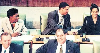  ?? FILE ?? North East St Ann MP Shahine Robinson (right) sits along side Andrew Holness and Olivia Grange during her first sitting in the House of Representa­tives in 2001.