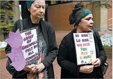  ?? CARL COURT/GETTY ?? Protesters express themselves outside a council meeting on the Grenfell fire. Most of those displaced remain in hotels.