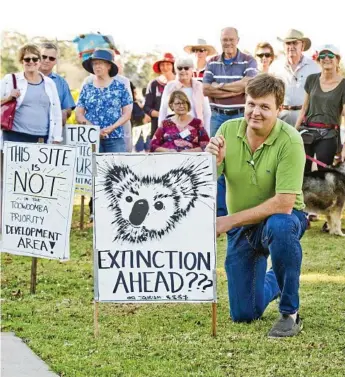  ?? Photos: Nev Madsen/Contribute­d ?? COMMUNITY ACTION: Geoff Sharp and other residents meet about the housing developmen­t on Rifle Range Road.