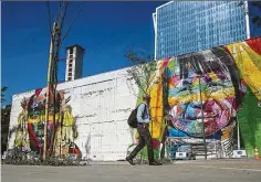  ?? — EPA ?? the new mural, dubbed We Are All One and which covers the entire front wall of an abandoned parking lot in the port of rio de Janeiro, portrays the faces of five indigenous individual­s, one for each continent.