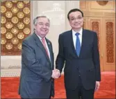  ?? PARKER SONG / REUTERS ?? Premier Li Keqiang stands with United Nations Secretary-General Antonio Guterres before their meeting at the Great Hall of the People in Beijing on Monday.