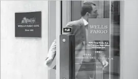  ?? Justin Sullivan Getty Images ?? AS PART OF Wells Fargo’s new incentive system, workers will get more base pay and less incentive and bonus pay. Above, a bank branch in San Francisco.