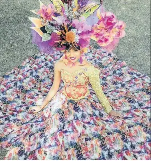  ??  ?? Model Deidre Chetty, 19, of Pietermari­tzburg, a first year chiropract­ic student, shows off a vibrant hat designed by Yasmin Saanglae, which will be worn to the Vodacom Durban July on Saturday. Saanglae has entered the Exceptiona­l Raceday Hat or Fascinator competitio­n. The theme is The Colour of Magic. For tips on the show-stopping event, and a chance to win VIP tickets for two valued at R10 000,