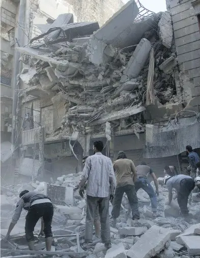  ?? KARAM AL-MASRI / AFP / GETTY IMAGES ?? The Syrian government and its Russian allies have unleashed the most destructiv­e bombing of the last five years on the city of Aleppo, in what appears to be their first all-out ground assault to retake the city from opposition forces.