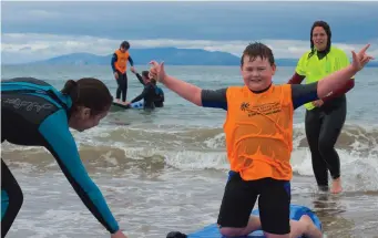  ??  ?? Learning to surf at Streedagh beach as part of the annual Surf4all programme.