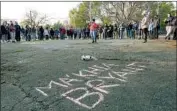  ?? Jeff Dean AFP/Getty Images ?? PEOPLE attend a vigil for Ma’Khia Bryant, 16, who was killed by a police officer in Columbus, Ohio.