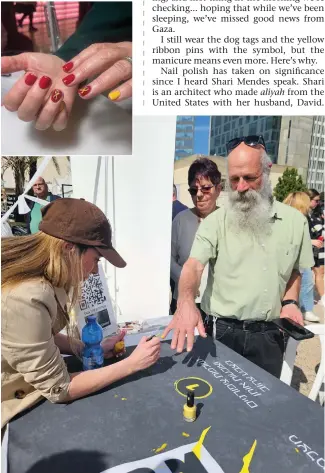  ?? (Courtesy Barbara Sofer) (David Zev Harris) ?? THE WRITER’S yellow ribbonador­ned nails.
ANAEL POLISHES nails in Tel Aviv’s Hostages Square.