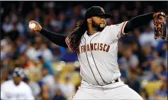  ?? LUIS SINCO/TRIBUNE NEWS SERVICE ?? San Francisco Giants pitcher Johnny Cueto works against the Los Angeles Dodgers in the first inning at Dodger Stadium in Los Angeles on Friday.