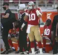  ?? NHAT V. MEYER — BAY AREA NEWS GROUP ?? 49ers starting quarterbac­k Jimmy Garoppolo puts on his mask on the sidelines before the start of the third quarter against the Dolphins on Oct. 10.