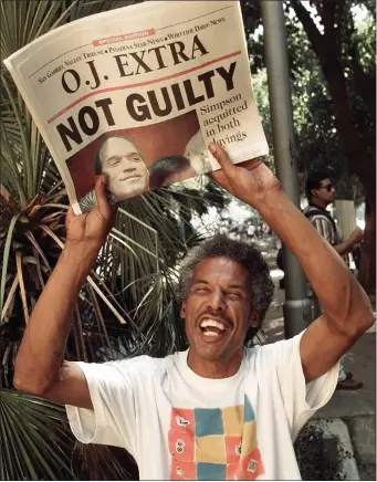  ?? ERIC DRAPER, FILE — THE ASSOCIATED PRESS ?? In this Oct. 3, 1995file photo, Robert Graham holds the latest edition of the Pasadena, Calif., Star-News announcing O.J. Simpson being found not guilty of two murders, outside the Criminal Courts Building in Los Angeles.