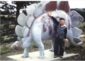  ??  ?? My brother Gene George at Dinosaur Park outside of Rapid City South Dakota in 1940. He didn’t know our family heritage bone belonged to a stegosauru­s!