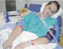  ?? Calgary Herald/files ?? Denis Telyakov, shown in hospital in Calgary, was in a coma for more than two weeks after a severe beating in the Calgary Remand Centre.