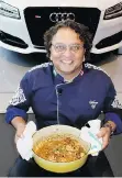  ??  ?? Restaurate­ur-chef Vikram Vij prepared a curry to his mother’s recipe at a demonstrat­ion in the OpenRoad Audi dealership’s showroom.