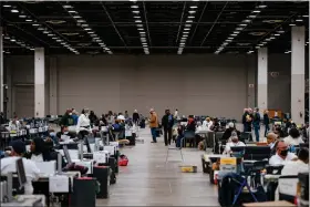  ?? NICK HAGEN — THE WASHINGTON POST ?? Absentee ballots are counted at Detroit’s convention center on Election Day.