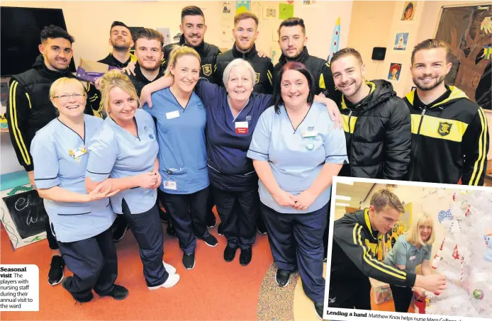  ??  ?? Seasonal visit The players with nursing staff during their annual visit to the ward