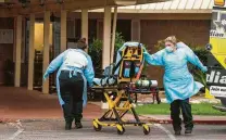  ?? Josie Norris / Staff file photo ?? First responders arrive at Southeast Nursing & Rehabilita­tion Center, where 18 residents have died of COVID-19, in San Antonio.