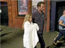  ??  ?? A child is escorted from the scene after the deadly attack at an Ariane Grande concert in Manchester.