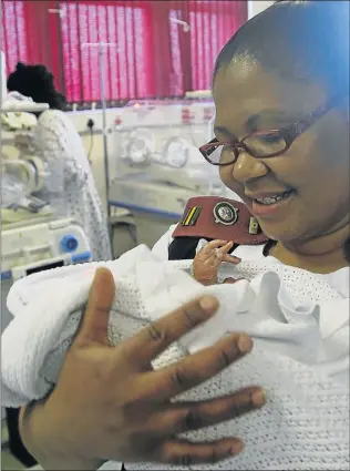  ?? Picture: MICHAEL PINYANA ?? HOPE FOR BLESSING:Yoliswa Mnyanda with baby Blessing who was found in a black plastic bag in Gonubie last week. He survived the traumatic ordeal and was named Blessing by staff at Frere Hospital. Offers have been pouring in on social media to help the...