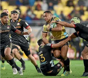  ?? GETTY IMAGES ?? The Chiefs sent plenty of defenders Ngani Laumape’s way on Friday.