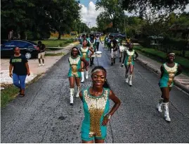  ?? Michael Ciaglo / Houston Chronicle ?? Worthing High School’s Prancing Dolls perform in a parade Saturday to drum up excitement for HISD’s Achieve 180 plan to help underperfo­rming schools.