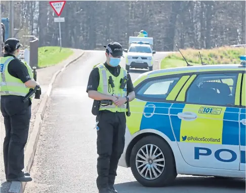  ??  ?? ROAD CLOSED: Police at the scene of the crash on the A90 just outside of Dundee. Picture by Gareth Jennings.