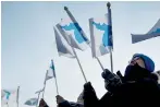  ?? AFP ?? People wave the Unified Korea flag before the opening ceremonies of the Pyeongchan­g 2018 Winter Olympic Games in Pyeongchan­g.