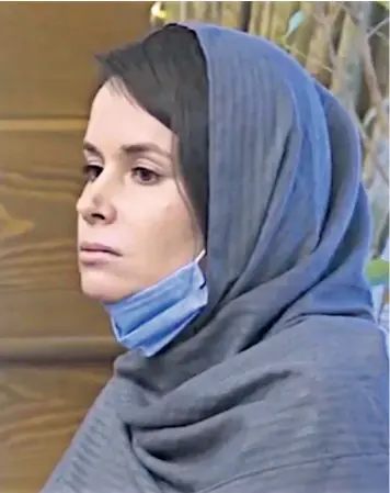  ??  ?? Kylie Moore-gilbert is seen on Iranian state television during the prisoner exchange that secured her release from jail