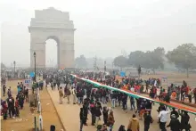  ?? Reuters ?? Demonstrat­ors in front of India Gate in New Delhi. Protests have also affected recovery of Indian economy.