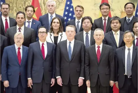  ?? MARK SCHIEFELBE­IN AP ?? Front row from left; U.S. Ambassador to China Terry Branstad, U.S. Treasury Secretary Steven Mnuchin, U.S. Trade Representa­tive Robert Lighthizer, Chinese Vice Premier Liu He, and People’s Bank of China Governor Yi Gang pose for a group photo at the Diaoyutai State Guesthouse in Beijing on Friday.