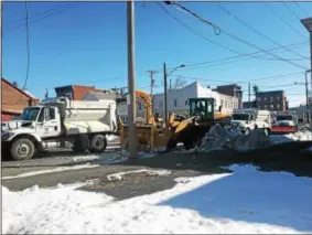  ?? PHOTOS BY NICHOLAS BUONANNO — NBUONANNO@TROYRECORD.COM ?? City officials in Cohoes are still sending out their plows to remove snow banks just one week after Winter Storm Stella hit the Capital Region.