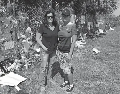  ?? [ROBERT RAY/THE ASSOCIATED PRESS] ?? Melissa Broccoli, left, and Christine Dunhill, both of whom have children at Marjory Douglas High School in Parkland, Fla. , meet in the same spot each day to pick up their kids.