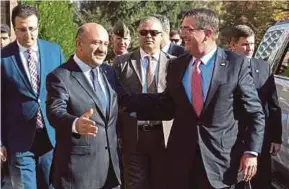  ??  ?? Fikri Isik
Ash Carter in Ankara
United Reuters pic