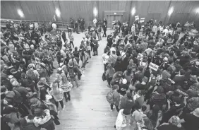  ?? JOSEPH CRESS/USA TODAY NETWORK ?? University of Iowa students divide into preference groups while they caucus Monday at the Iowa Memorial Union in Iowa City.