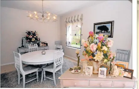  ??  ?? ELEGANT: The spacious dining room with a close-up of the sideboard