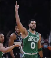  ?? CHARLES KRUPA — THE ASSOCIATED PRESS ?? Celtics forward Jayson Tatum, who had 19points, celebrates after a basket against the Bucks in Game 2.