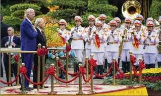  ?? EVAN VUCCI / ASSOCIATED PRESS ?? President Joe Biden participat­es in a welcome ceremony hosted by Vietnam’s Communist Party General Secretary Nguyen Phu Trong at the Presidenti­al Palace in Hanoi on Sunday.