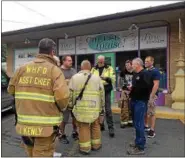  ?? DIANE PINEIRO ZUCKER — DAILY FREEMAN ?? Fire officials at the scene of a chemical spill at Cheese Louise! on Route 28 on Saturday.