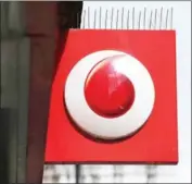  ?? DANIEL LEAL-OLIVAS/AFP ?? A Vodafone logo is seen at a store in central London yesterday.
