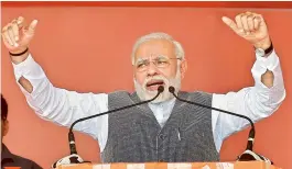 ?? — PTI ?? Prime Minister Narendra Modi addresses an election rally in Sanand, Gujarat, on Sunday. Polling for the second phase will be held on December 14.