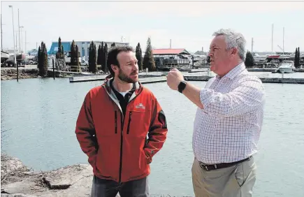  ?? KRIS DUBE
SPECIAL TO THE WELLAND TRIBUNE ?? Sugarloaf Marina general manager Mark Minor, left, and Port Colborne chief administra­tive officer Scott Luey look forward to the upcoming season on Lake Erie.