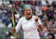  ?? PETR DAVID JOSEK — THE ASSOCIATED PRESS ?? Latvia’s Jelena Ostapenko clenches her fist after scoring a point against Caroline Wozniacki during their quarterfin­al match at the French Open on Tuesday.