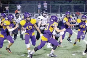  ?? The Sentinel-Record/Jami Smith ?? BIG PICK: Fountain Lake freshman Kadin Hilton (42) runs behind eighth-grade teammate Kobe Combs (23) Thursday after picking off a pass from Joe T. Robinson freshman quarterbac­k Jack Cleveland at Allen Tillery Field. The junior Cobras defeated the junior Senators, 26-20, in overtime.