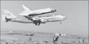  ??  ?? SHUTTLE: In this Feb. 18, 1977 photo, America’s Space Shuttle Enterprise, rides atop a giant 747 on its first test flight at Edwards Air Force Base, Calif. Enterprise is scheduled to arrive in New York on the back of a NASA jumbo jet on Friday where it...